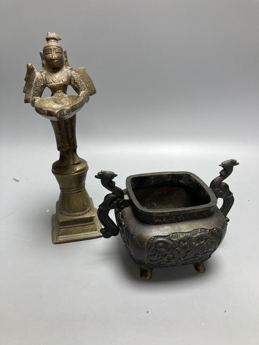 A Chinese bronze censor and a Buddhist figural stoop, stoop, 23cm high